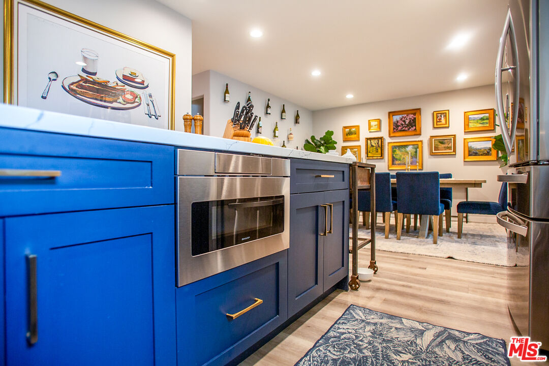137 Main Street Los Alamos, CA 93440 - Photo 15 of 52 a view of a dining room with furniture window and wooden floor