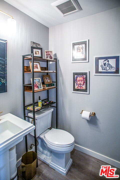 137 Main Street Los Alamos, CA 93440 - Photo 18 of 52 a bathroom with a toilet and a sink