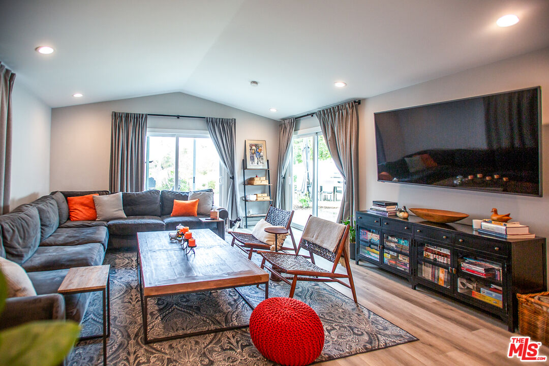 137 Main Street Los Alamos, CA 93440 - Photo 20 of 52 a living room with furniture and a flat screen tv