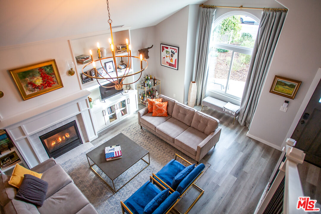 137 Main Street Los Alamos, CA 93440 - Photo 26 of 52 a living room with furniture and a fireplace