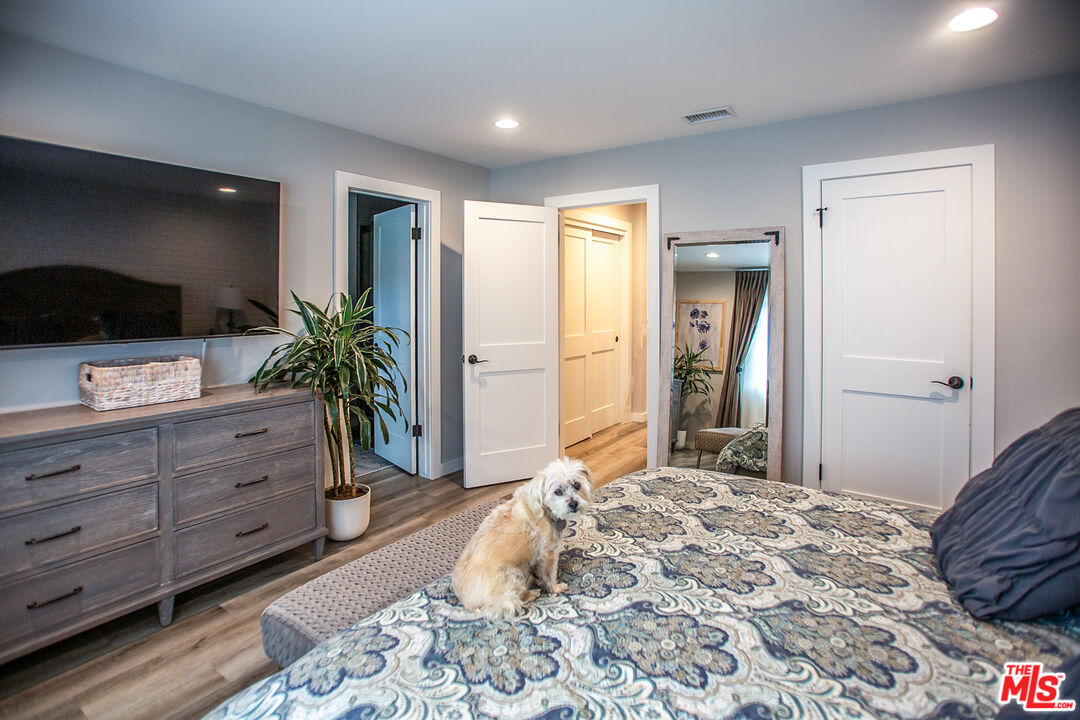 137 Main Street Los Alamos, CA 93440 - Photo 30 of 52 a bedroom with a bed and a flat screen tv