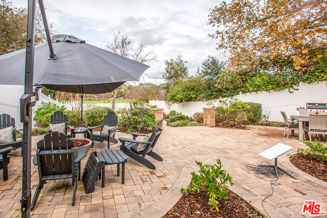 137 Main Street Los Alamos, CA 93440 - Photo 40 of 52 a view of a patio with furniture and a yard