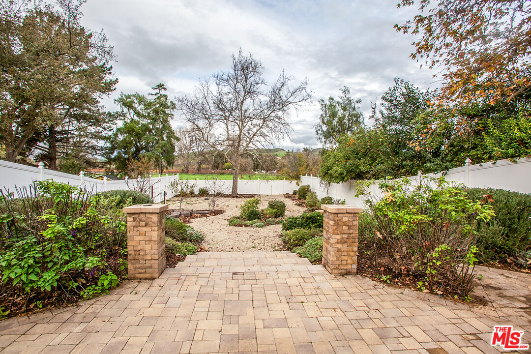 137 Main Street Los Alamos, CA 93440 - Photo 46 of 52 a view of a yard with plants and trees