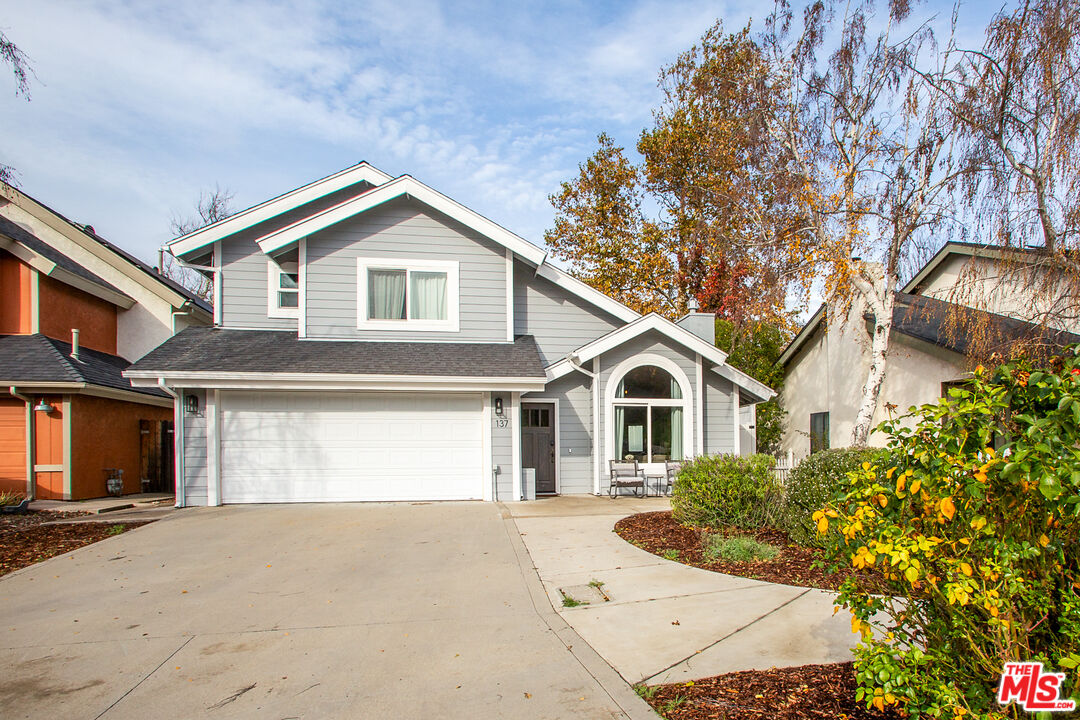 137 Main Street Los Alamos, CA 93440 - Photo 52 of 52 a front view of a house with a yard and garage
