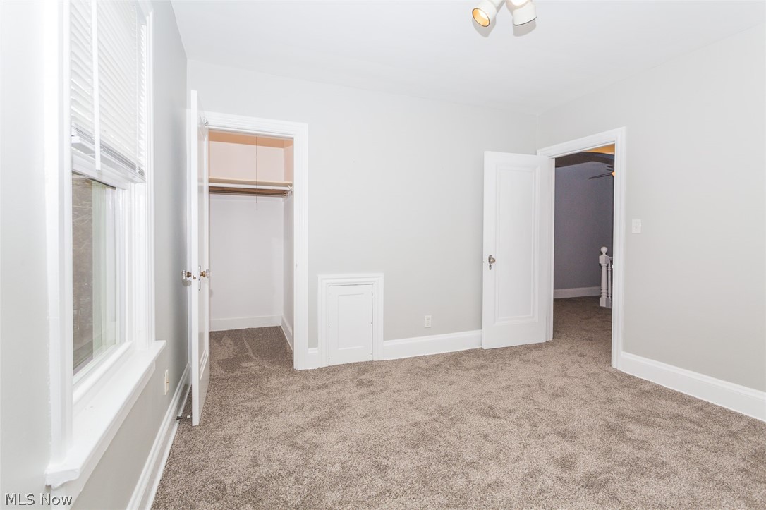 715 Mentor Road Akron, OH 44303 - Photo 24 of 34 Bedroom 2 offers a large closet and ceiling light.
