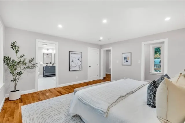 a bedroom with a large bed and a couch