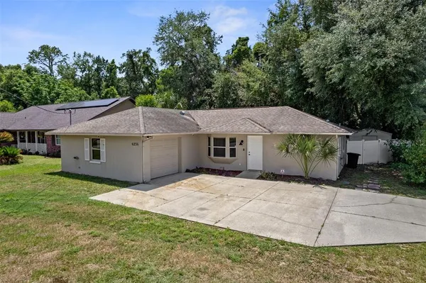 a house with trees in the background