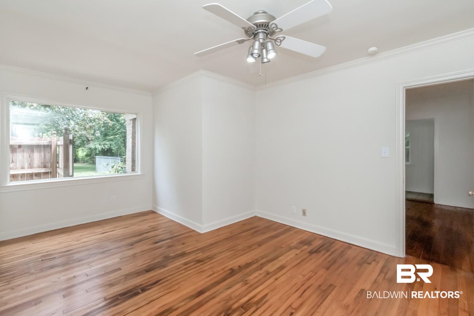 1906 Old Shell Road Mobile, AL 36607 - Photo 21 of 26 Spare room featuring ornamental molding, light hardwood / wood-style flooring, and ceiling fan