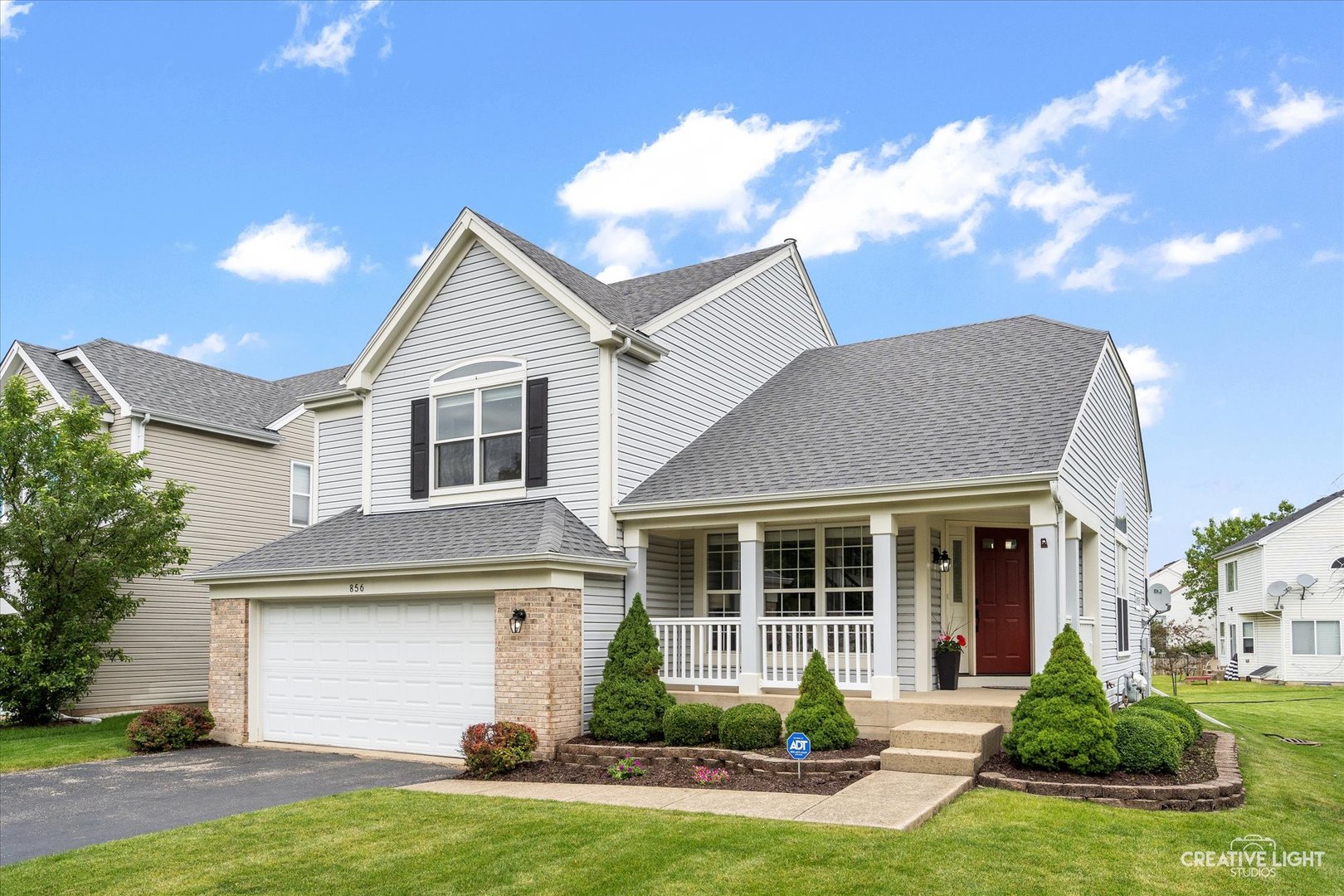 856 Violet Circle Naperville, IL 60540 - Photo 1 of 3 a front view of a house with a yard and garage