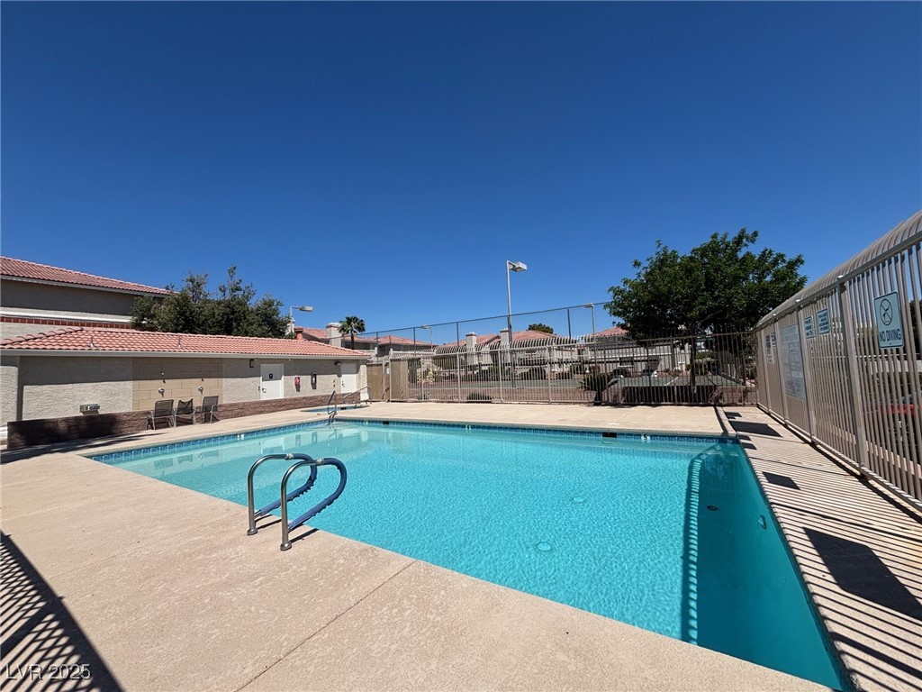 7300 West Pirates Cove Road, Unit 2054 Las Vegas, NV 89145 - Photo 3 of 16 Community pool featuring fence