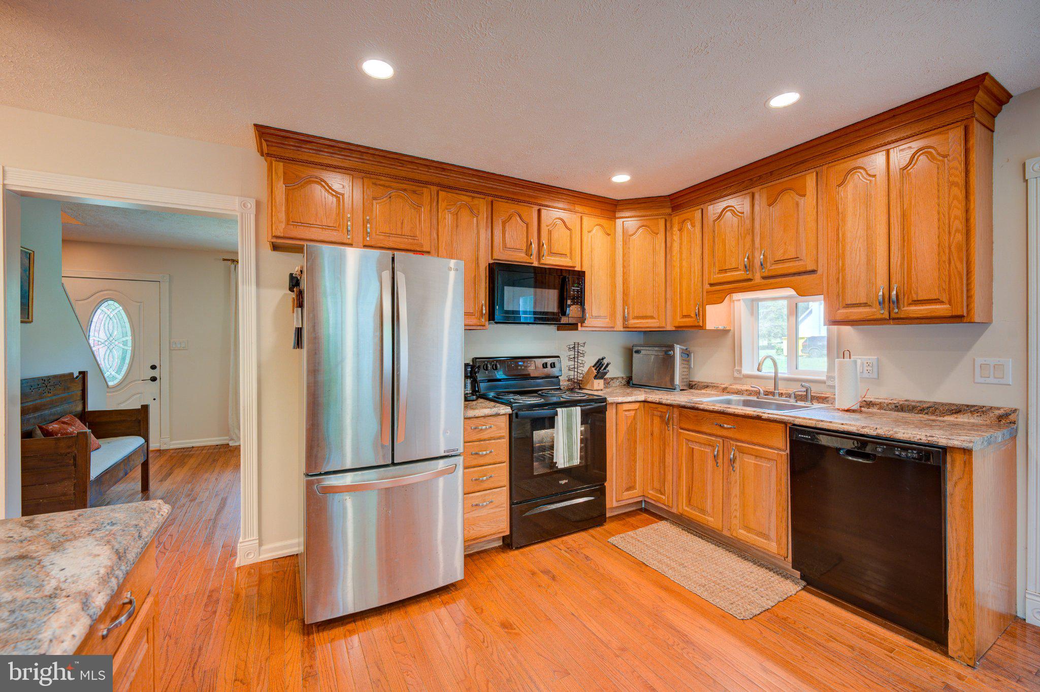 9595 Roys Lane Culpeper, VA 22701 - Photo 7 of 61 Warm wood tones in a cozy kitchen.