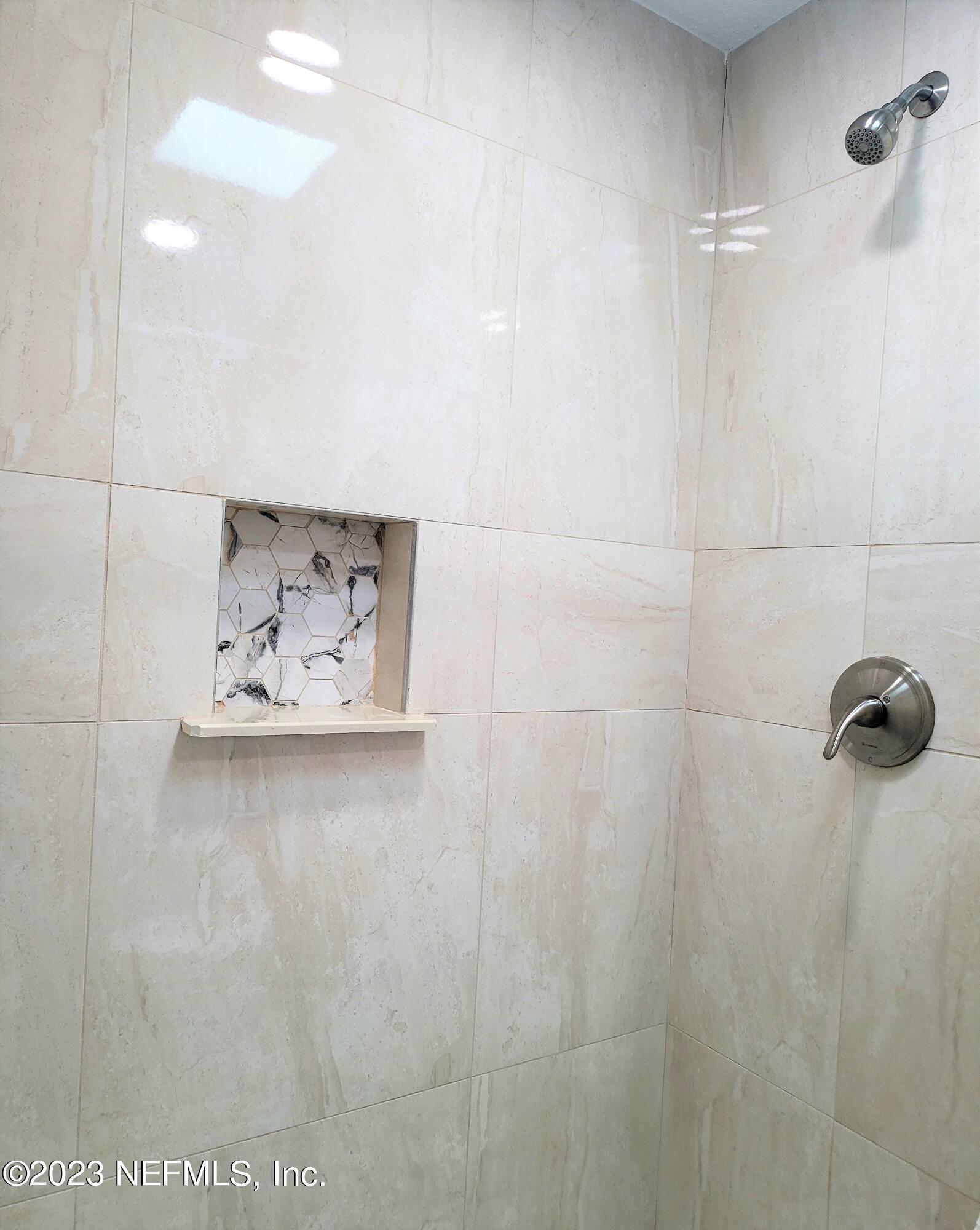 2627 Adele Road Jacksonville, FL 32216 - Photo 19 of 27 a picture of a bathroom with a shower
