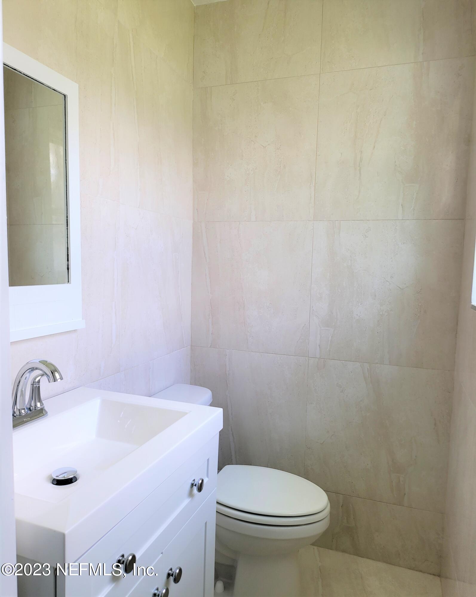 2627 Adele Road Jacksonville, FL 32216 - Photo 21 of 27 a bathroom with a sink and a toilet