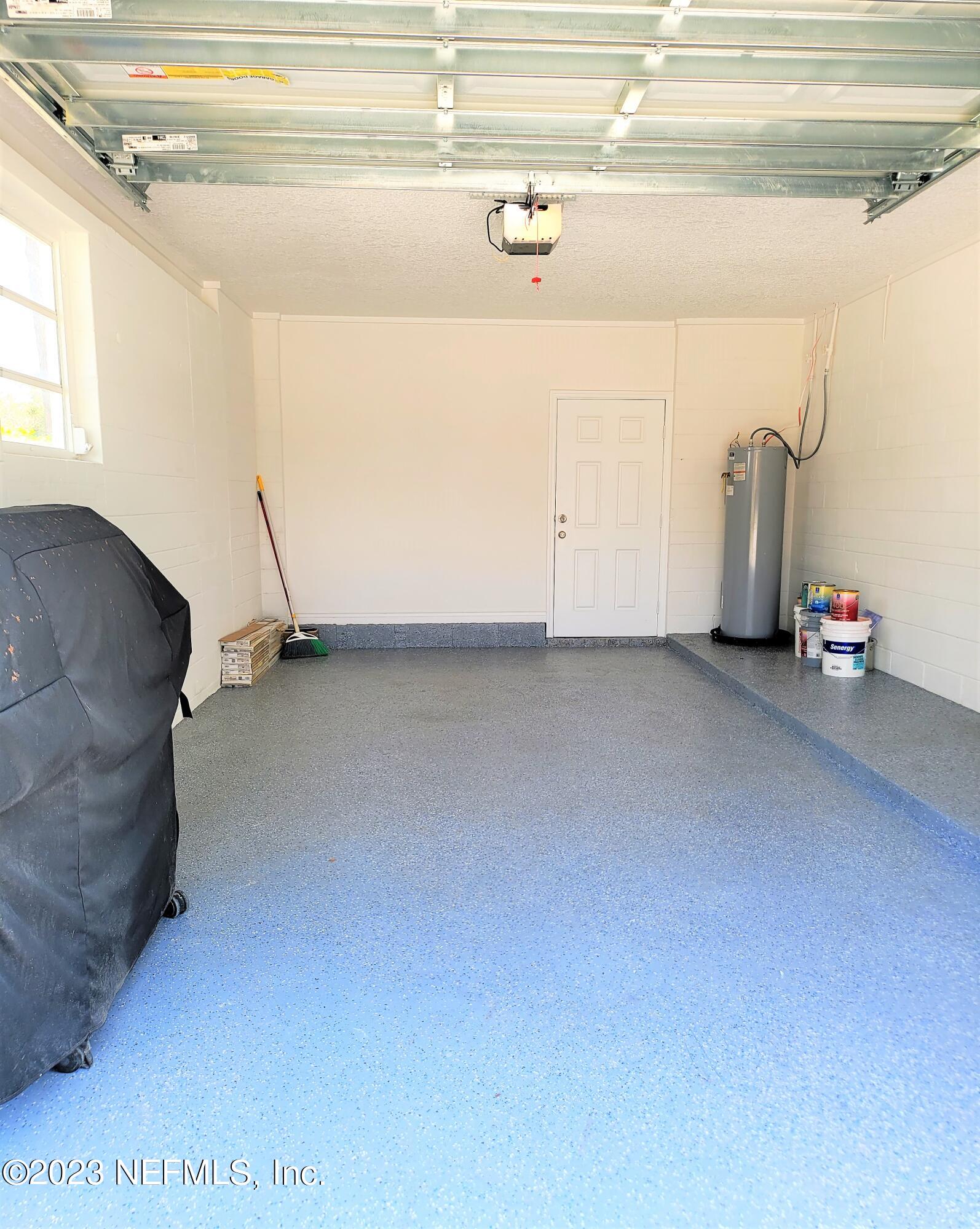 2627 Adele Road Jacksonville, FL 32216 - Photo 22 of 27 a view of a room with gym equipment and a window