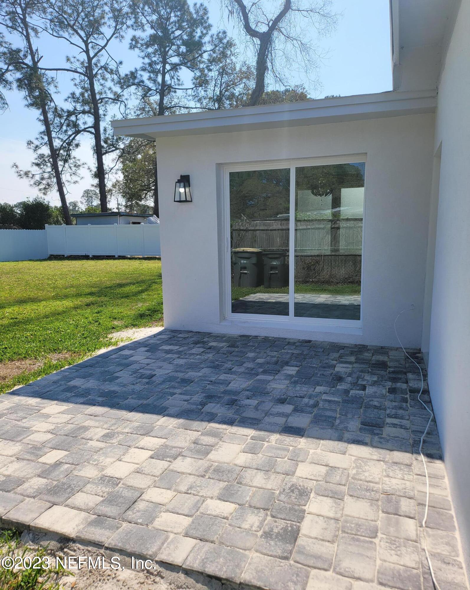 2627 Adele Road Jacksonville, FL 32216 - Photo 23 of 27 a view of a house with a yard