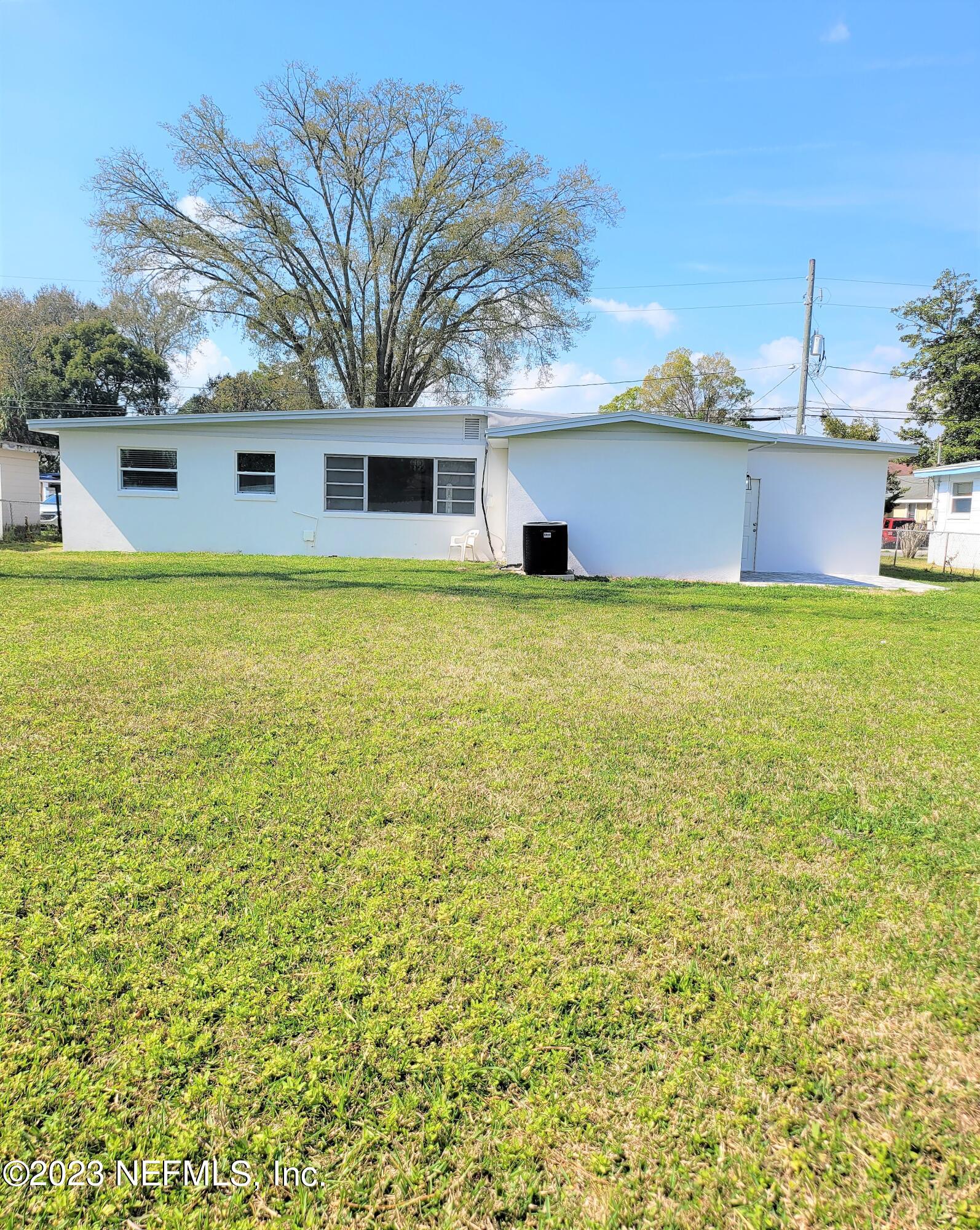 2627 Adele Road Jacksonville, FL 32216 - Photo 25 of 27 a view of a house with a backyard