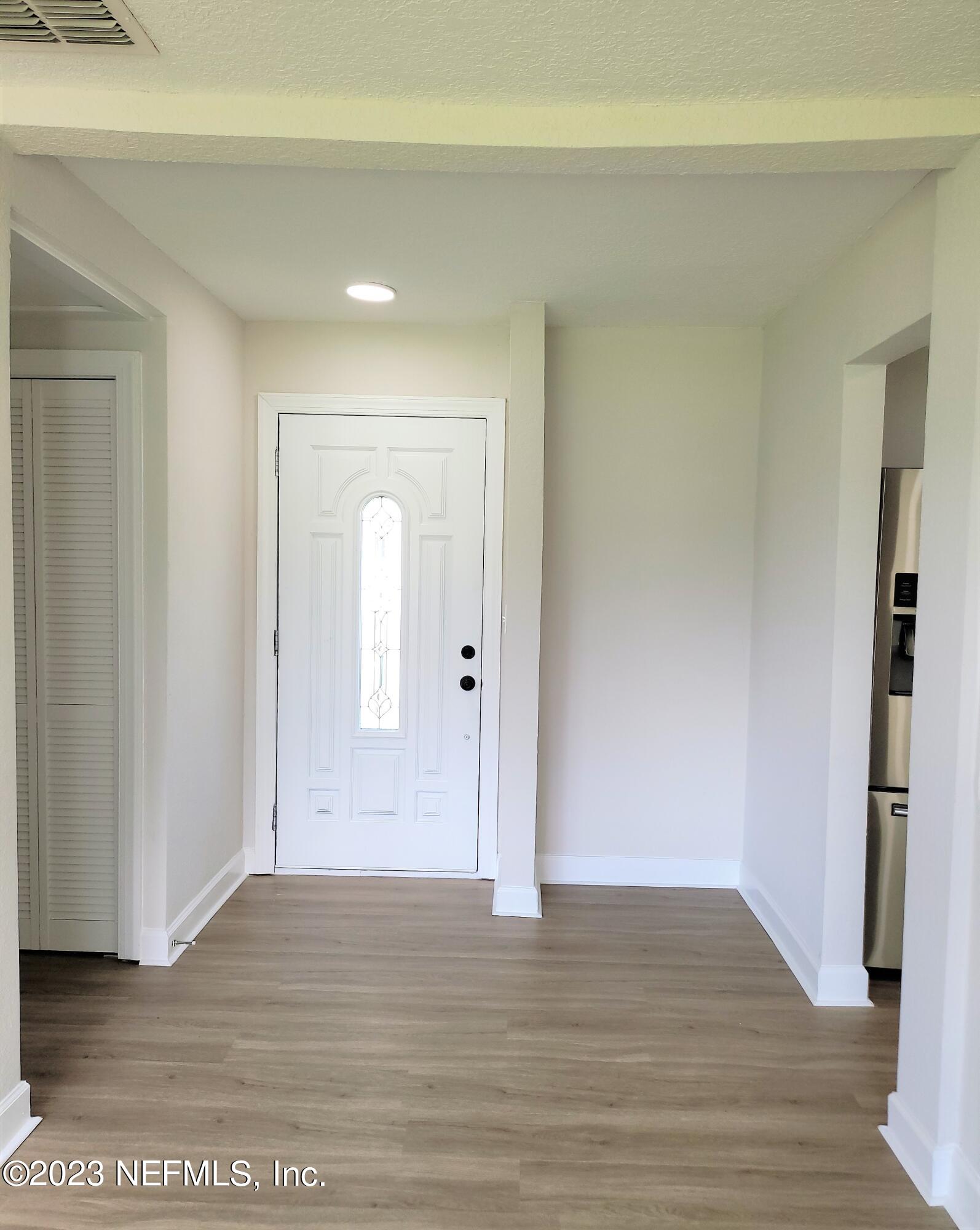 2627 Adele Road Jacksonville, FL 32216 - Photo 5 of 27 a view of a room with wooden floor and bathroom