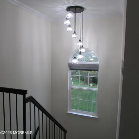 a view of a hallway with windows
