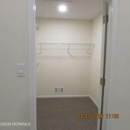 a view of an empty walk in closet