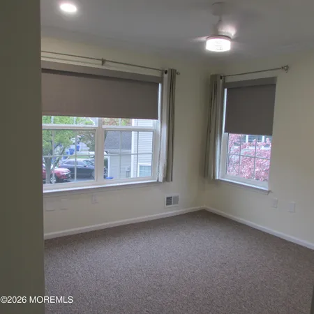an empty room with a empty space and window