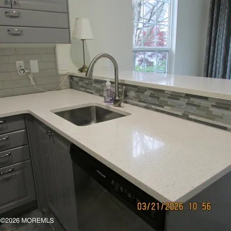 a kitchen with a sink and cabinets