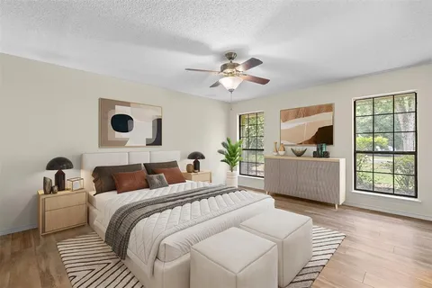 a bedroom with a large bed and a window