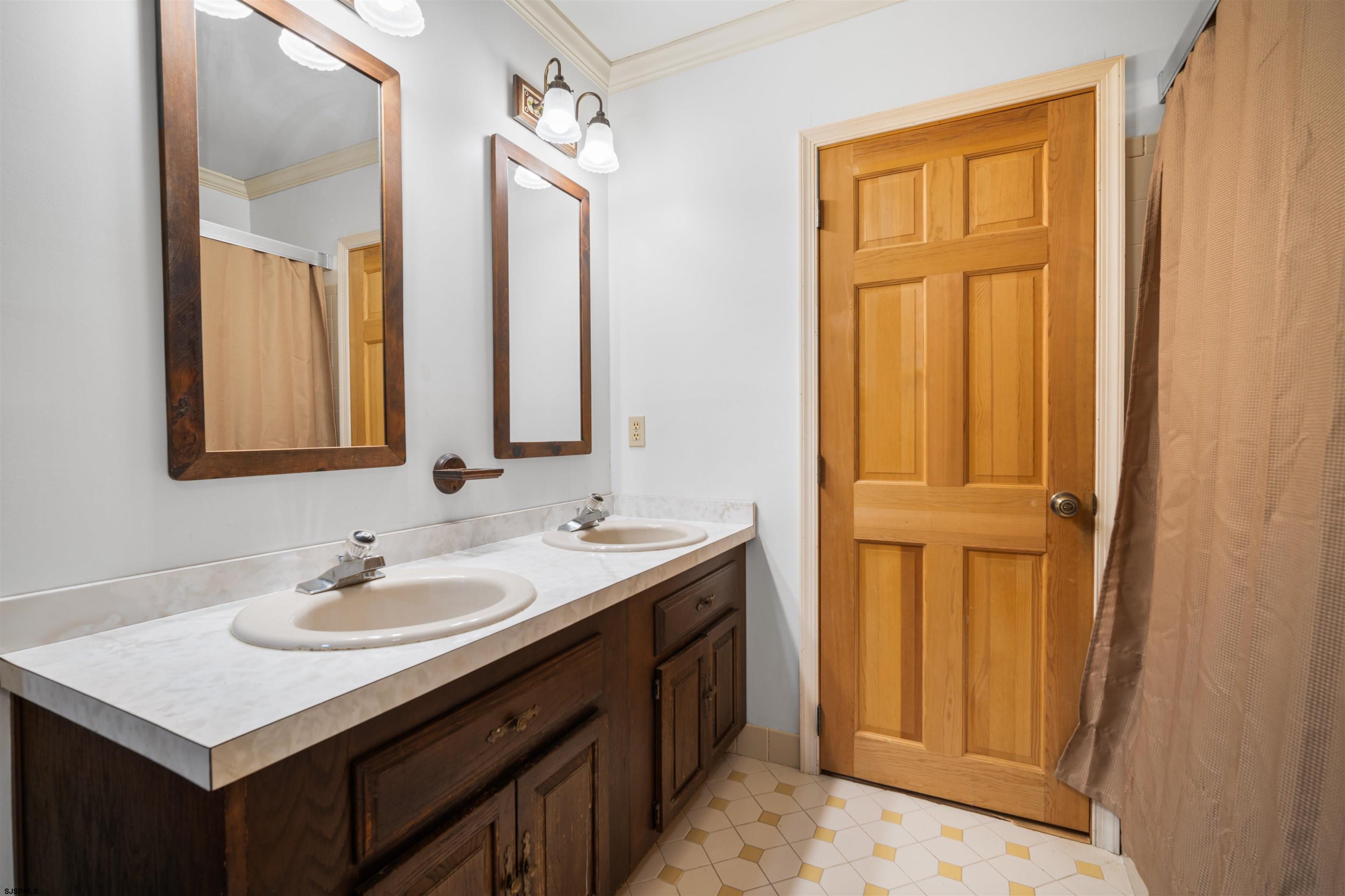 216 Riverside Drive Port Republic, NJ 08241 - Photo 19 of 47 a bathroom with a sink a vanity and a mirror