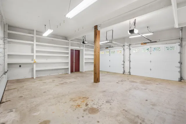 a view of a room with a refrigerator