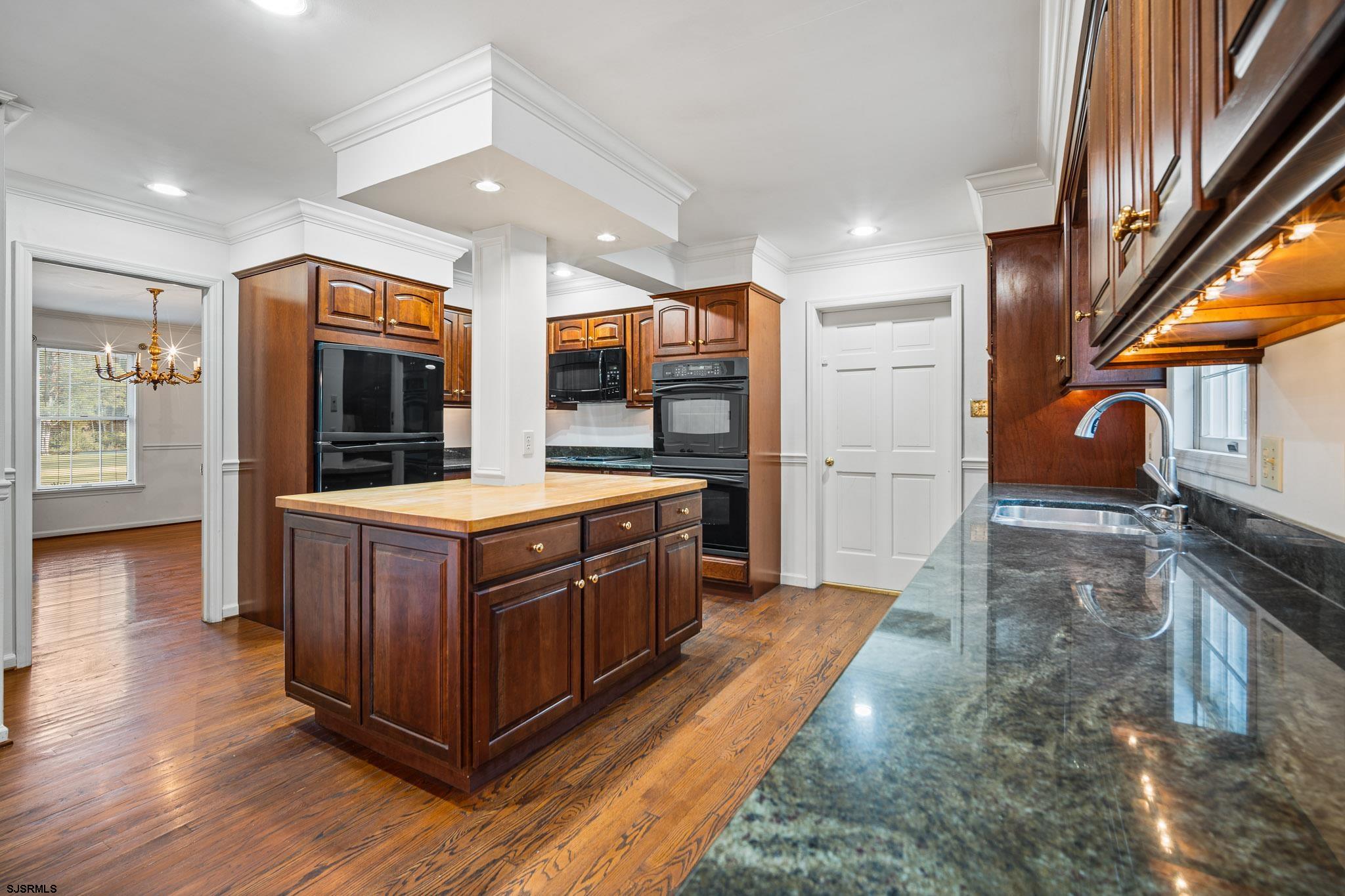 216 Riverside Drive Port Republic, NJ 08241 - Photo 3 of 47 a kitchen with stainless steel appliances granite countertop a stove a sink and a refrigerator