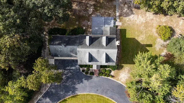 an aerial view of a house with swimming pool