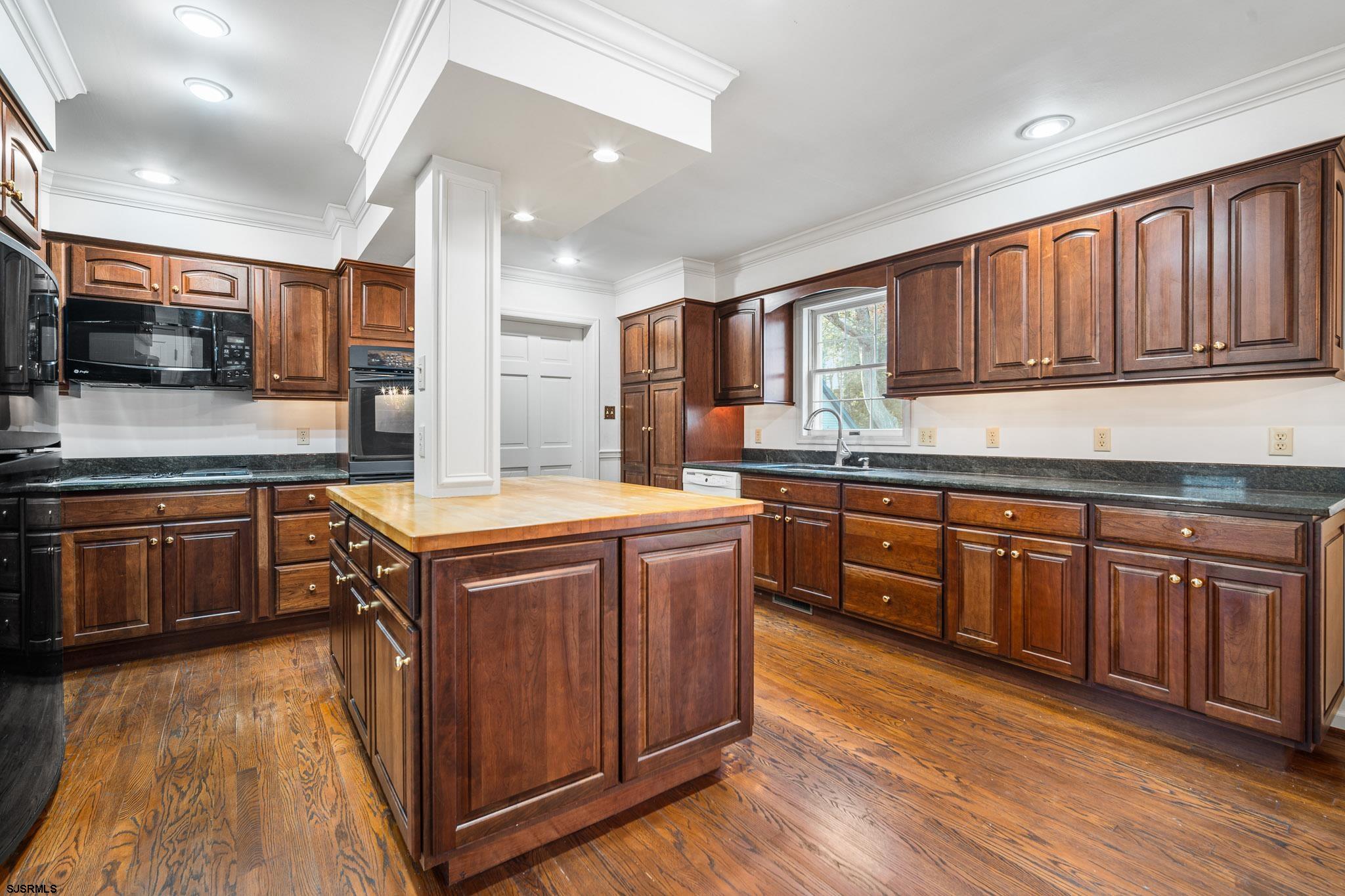 216 Riverside Drive Port Republic, NJ 08241 - Photo 4 of 47 a kitchen with stainless steel appliances granite countertop wooden cabinets sink and stove