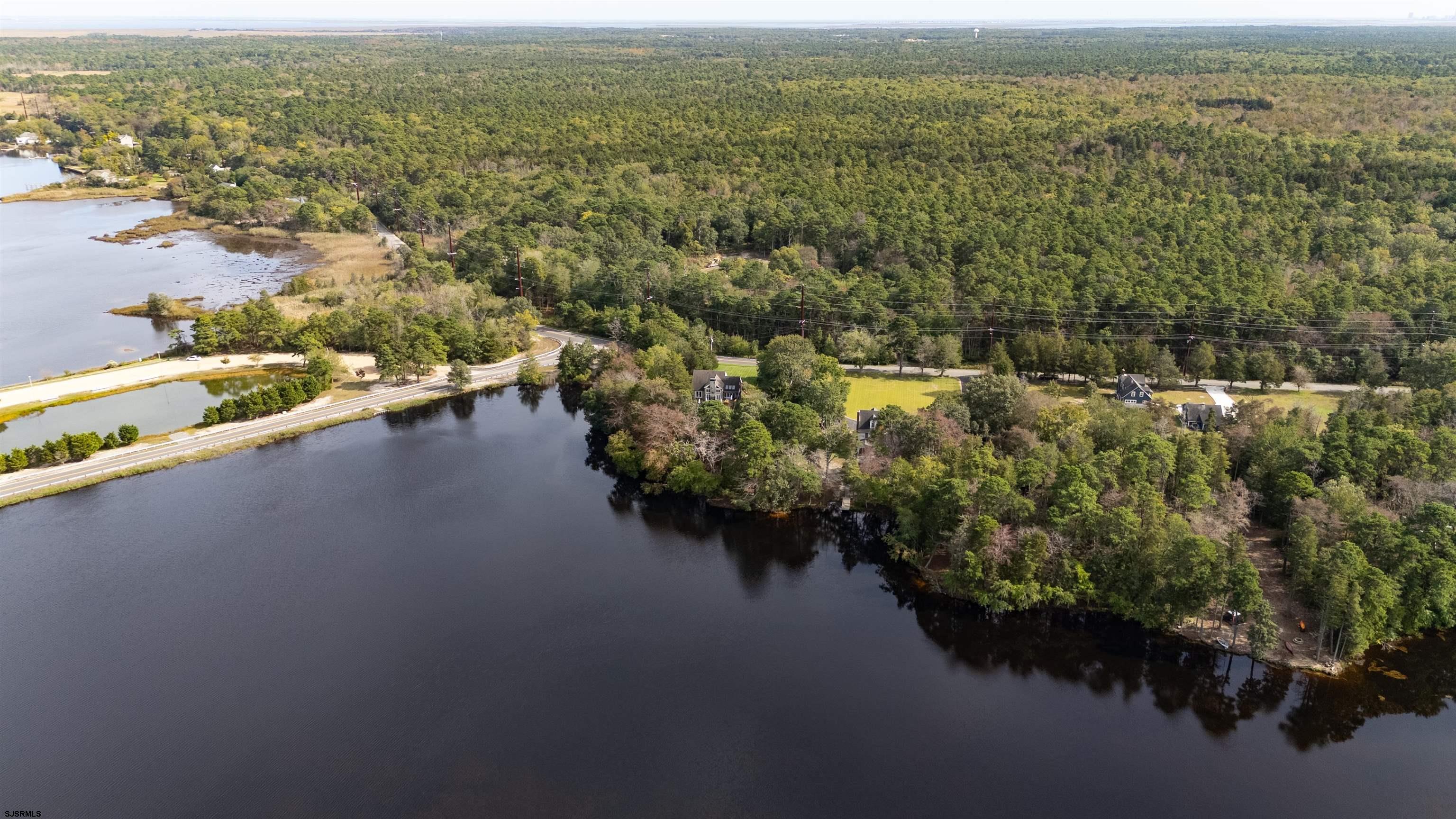 216 Riverside Drive Port Republic, NJ 08241 - Photo 43 of 47 an aerial view of residential houses with outdoor space and river