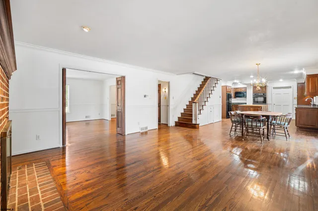 a view of kitchen with furniture and wooden floor