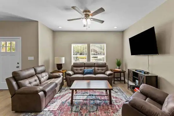 a living room with furniture and a flat screen tv