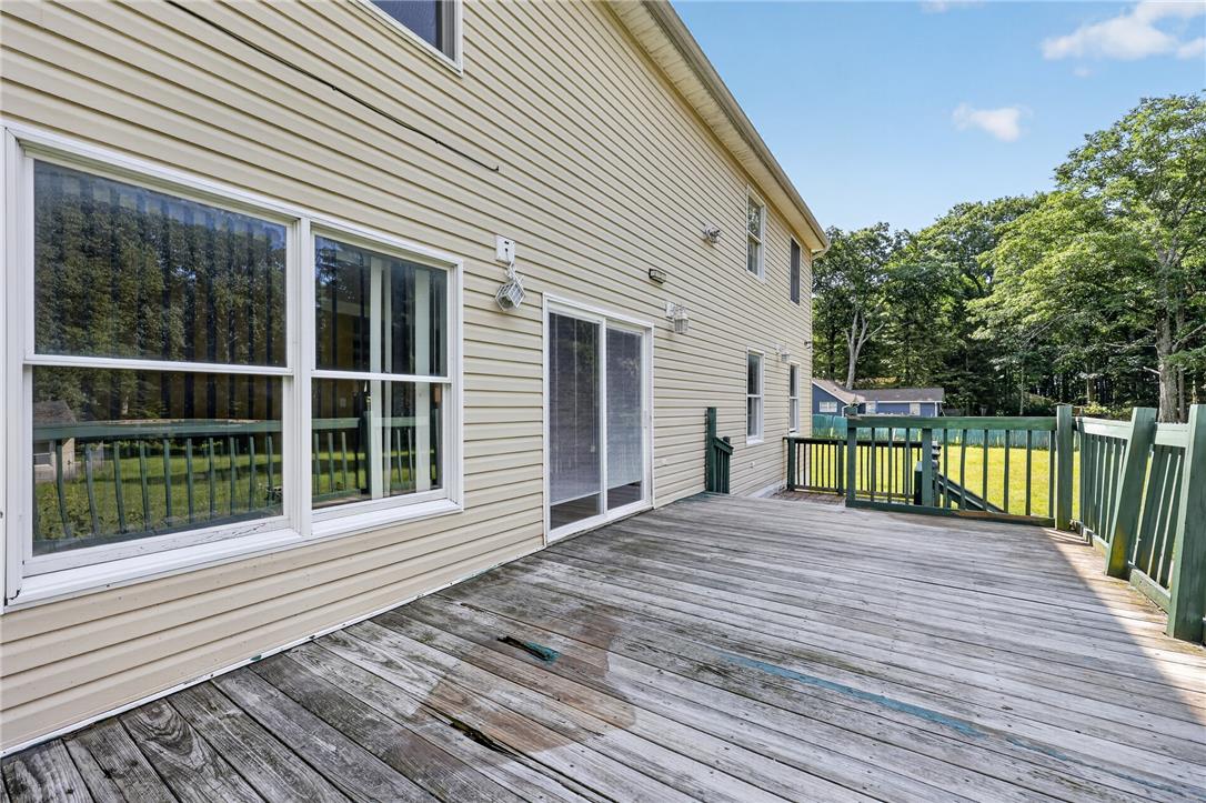 2882 Locust Ridge Road Pocono Lake, PA 18347 - Photo 10 of 45 An inviting outdoor deck provides ample space for relaxation and entertaining, seamlessly connecting to the home's exterior.