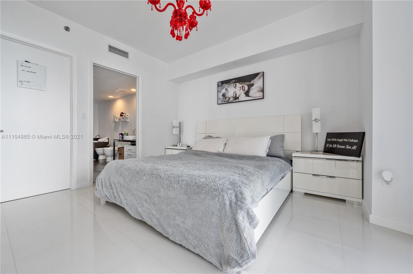 465 Brickell Avenue, Unit 2702 Miami, FL 33131 - Photo 20 of 37 a large white bed in a white room