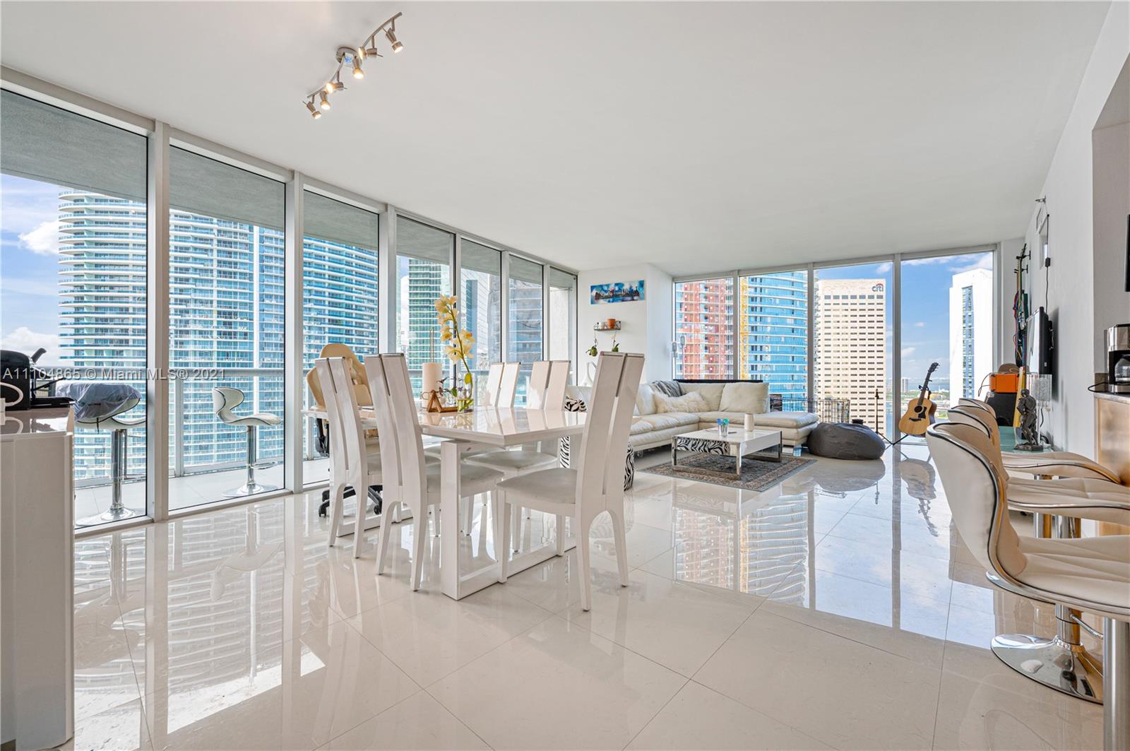 465 Brickell Avenue, Unit 2702 Miami, FL 33131 - Photo 4 of 37 a view of a dining room with furniture window and outside view