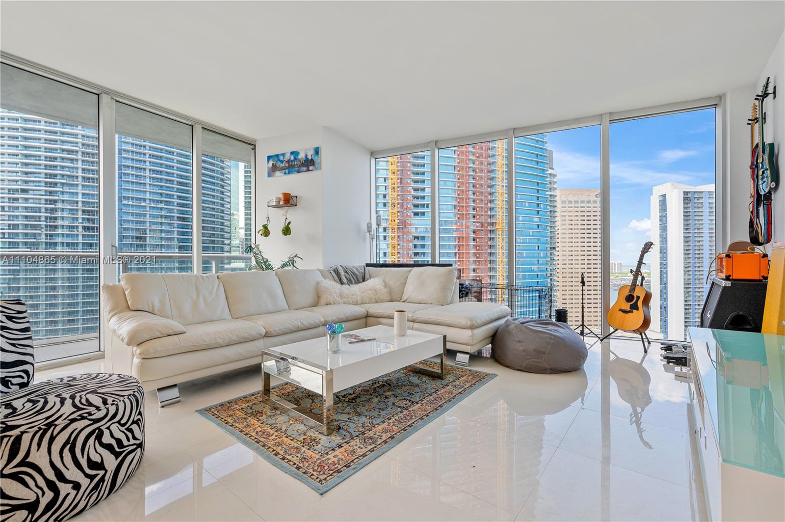 465 Brickell Avenue, Unit 2702 Miami, FL 33131 - Photo 8 of 37 a living room with furniture and a large window