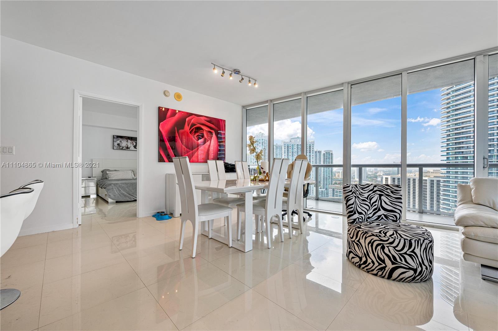 465 Brickell Avenue, Unit 2702 Miami, FL 33131 - Photo 10 of 37 a living room with furniture and a large window