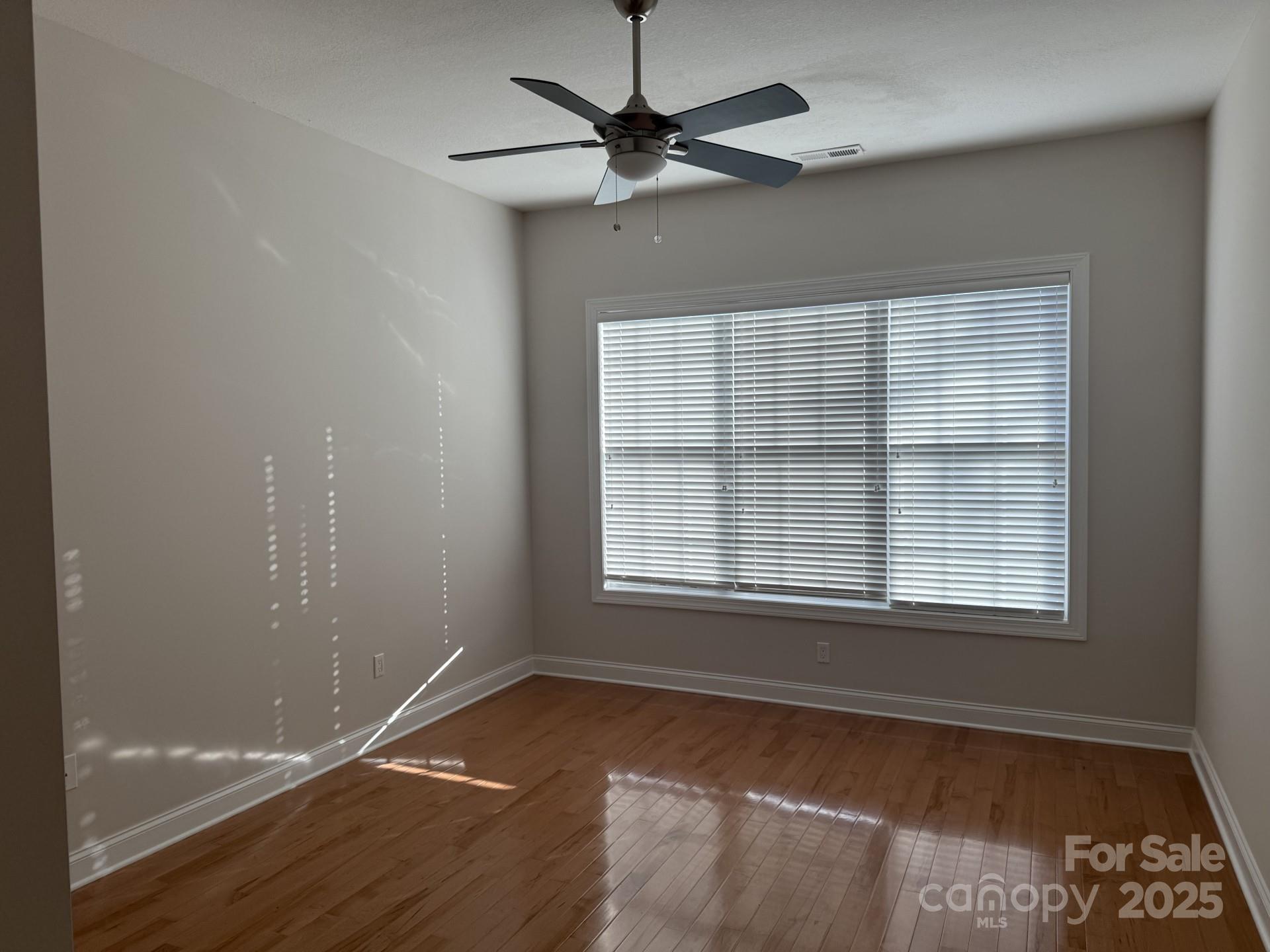 18 Eagle Pointe Way Flat Rock, NC 28731 - Photo 20 of 33 a view of a livingroom with a window and a ceiling fan