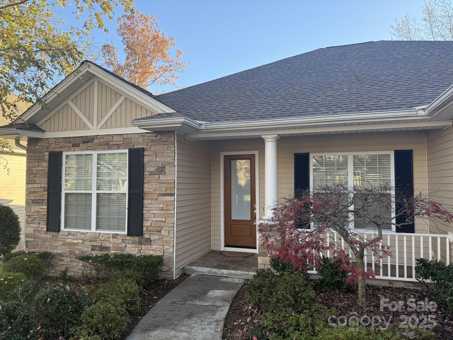 18 Eagle Pointe Way Flat Rock, NC 28731 - Photo 2 of 33 a front view of a house with a yard
