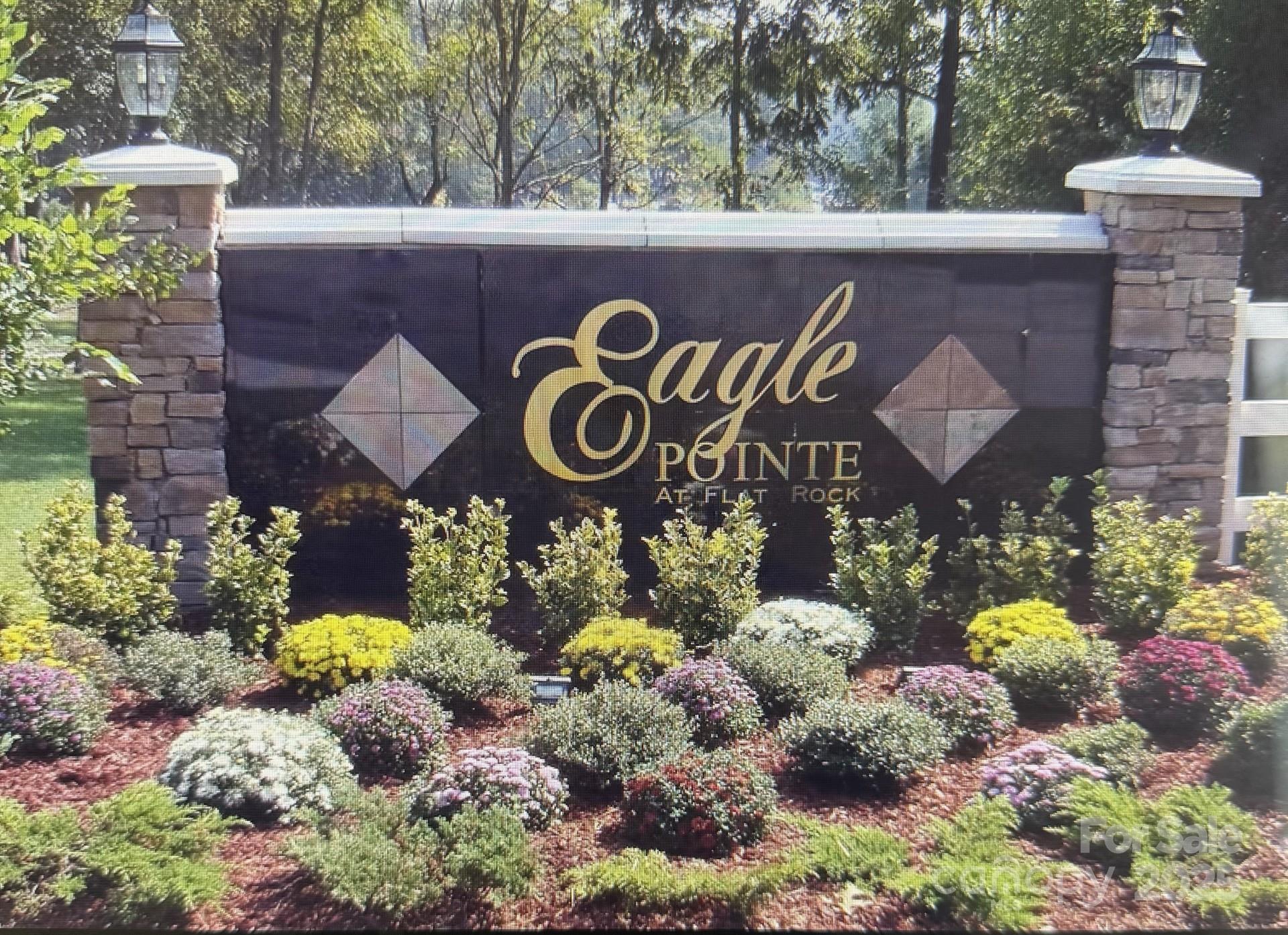 18 Eagle Pointe Way Flat Rock, NC 28731 - Photo 4 of 33 a street sign that is on a table