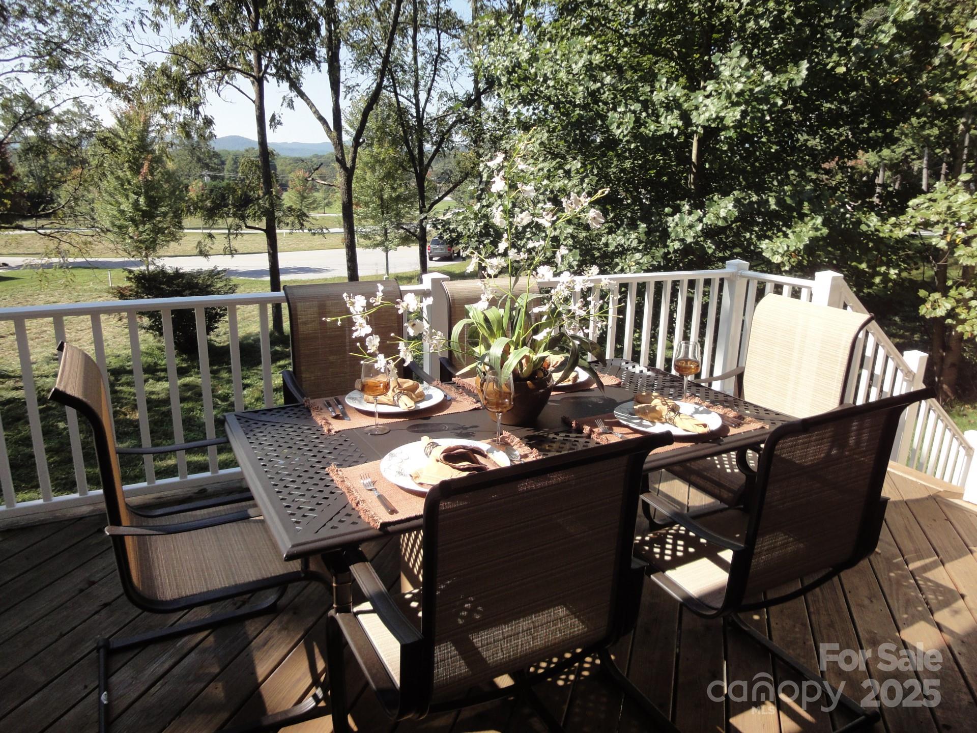 18 Eagle Pointe Way Flat Rock, NC 28731 - Photo 7 of 33 a view of a balcony dining area with furniture