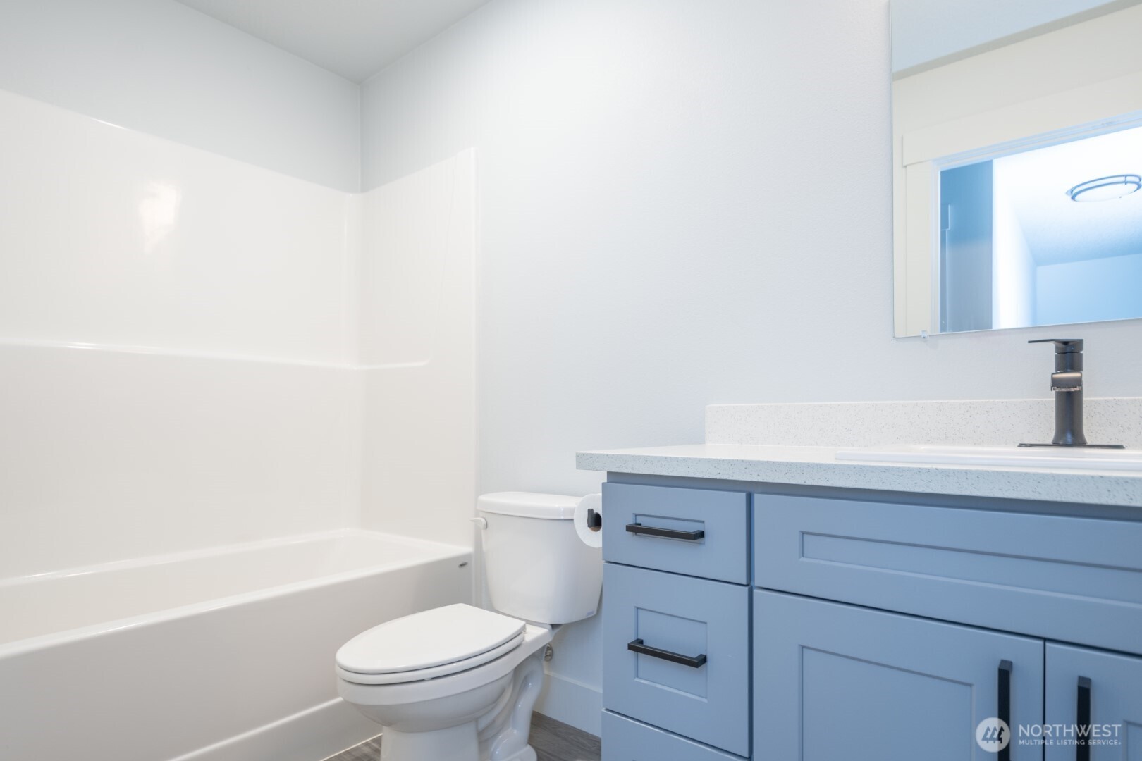 206 Oak Street Winlock, WA 98596 - Photo 11 of 21 a bathroom with a sink a toilet and shower