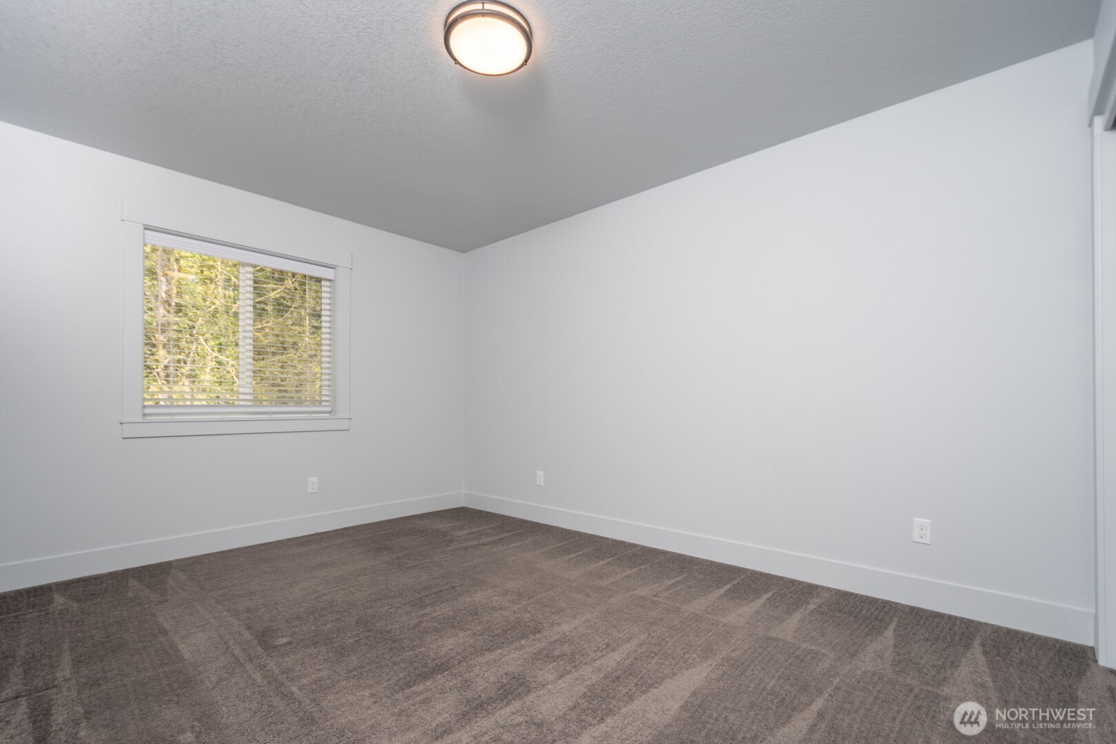 206 Oak Street Winlock, WA 98596 - Photo 12 of 21 an empty room with windows