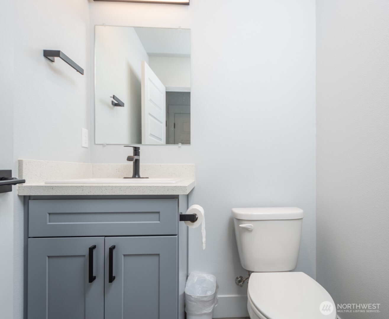 206 Oak Street Winlock, WA 98596 - Photo 13 of 21 a bathroom with a sink mirror and toilet