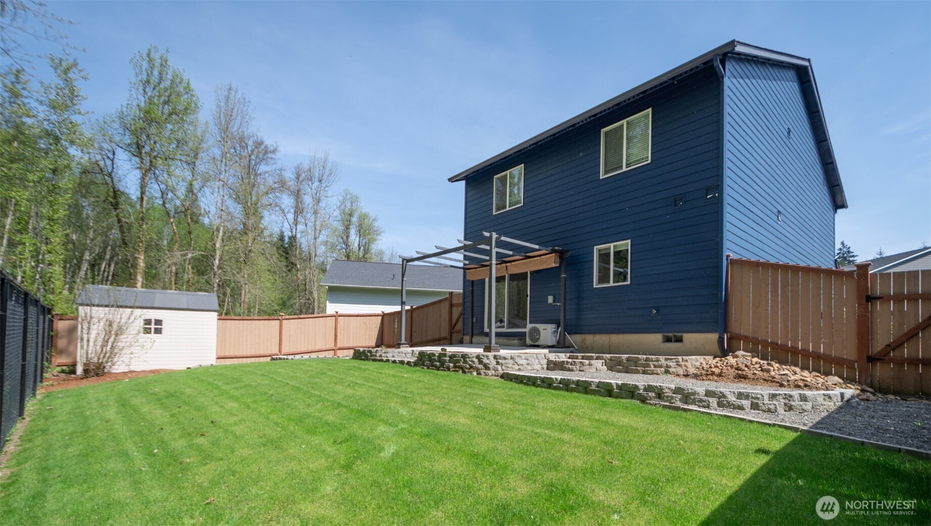 206 Oak Street Winlock, WA 98596 - Photo 15 of 21 a view of a house with a yard and sitting area