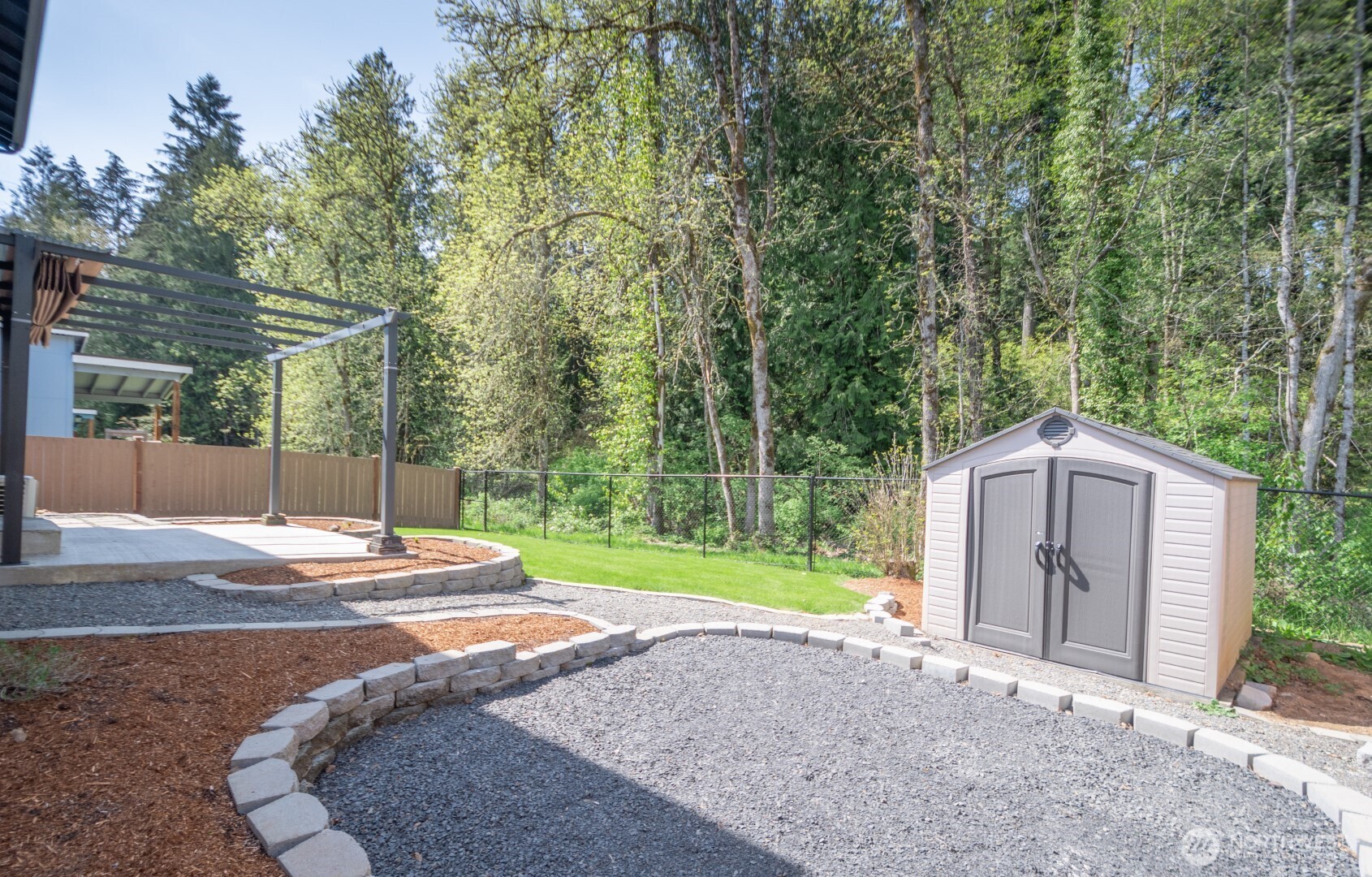206 Oak Street Winlock, WA 98596 - Photo 16 of 21 a backyard of a house with trees and outdoor space