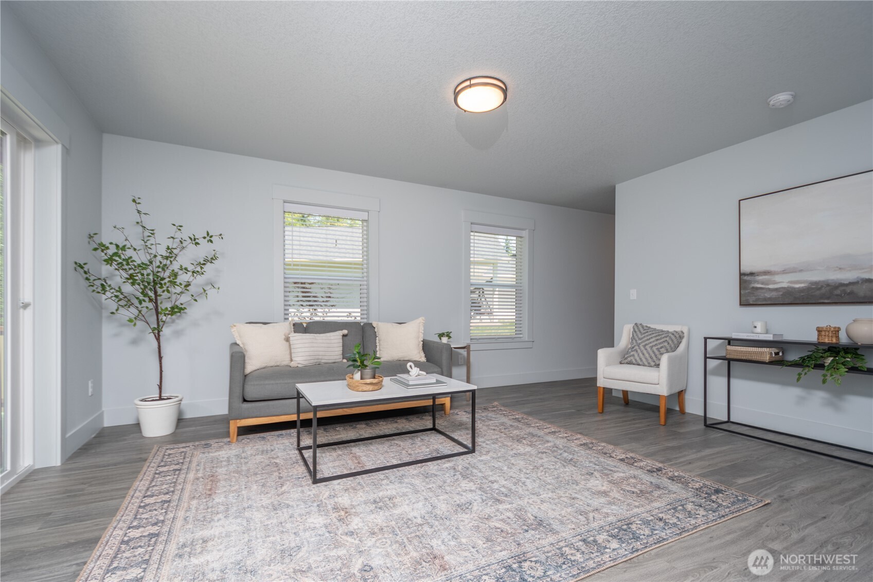 206 Oak Street Winlock, WA 98596 - Photo 2 of 21 a living room with furniture and a potted plant
