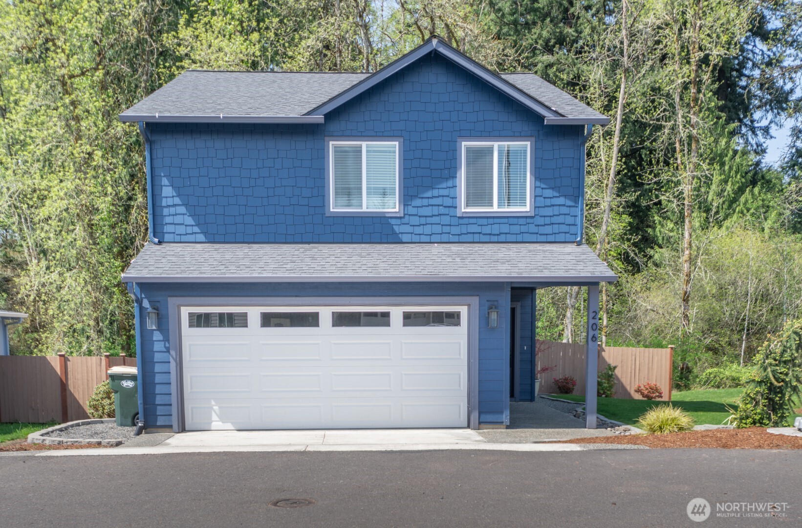 206 Oak Street Winlock, WA 98596 - Photo 21 of 21 a front view of a house with a garage